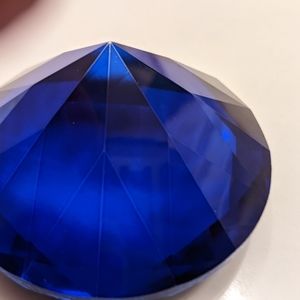 Royal Blue Glass Paperweight in the shape of a diamond